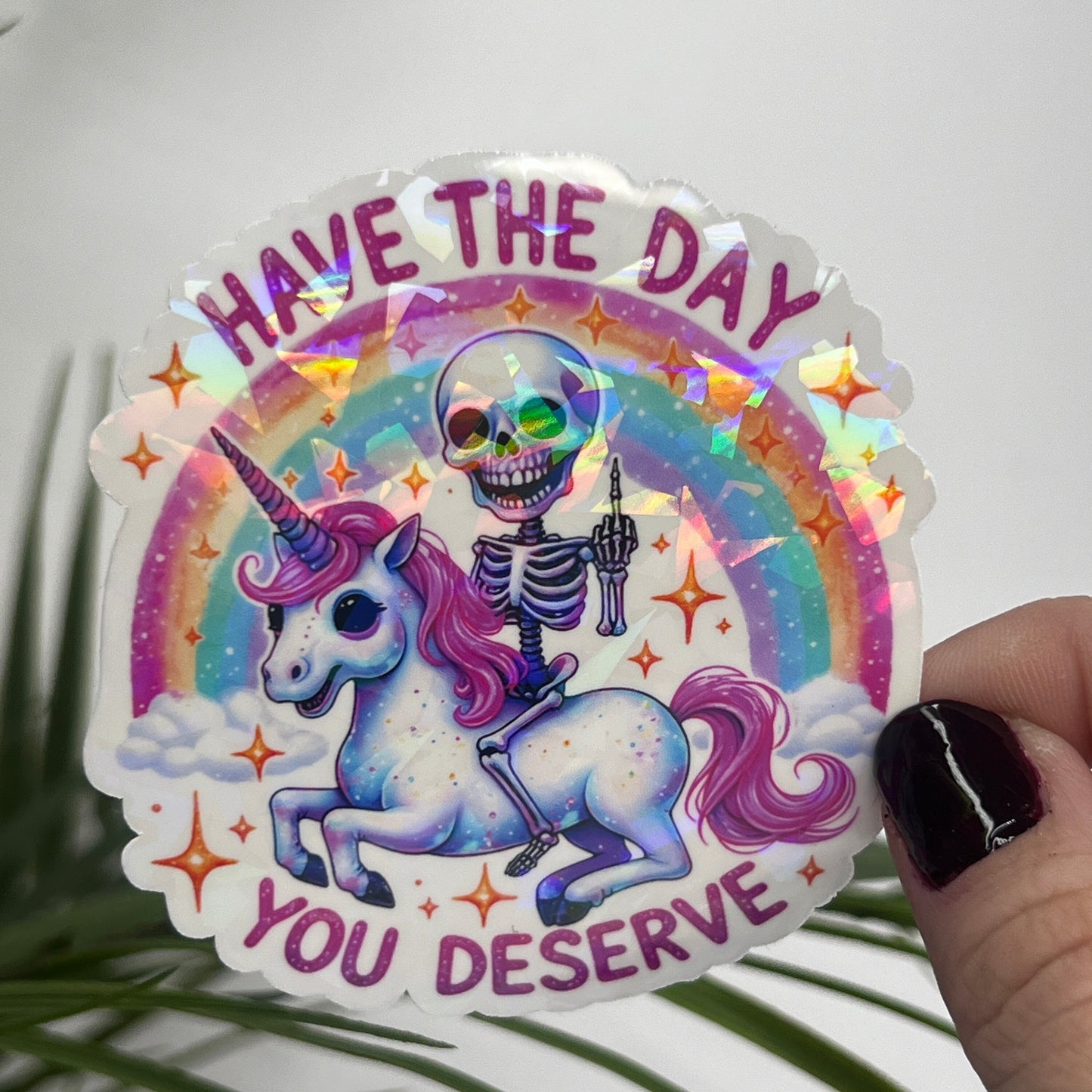 Holographic "Have the Day You Deserve" Skeleton Riding Unicorn Decal Middle Finger Rainbow Sticker | Sassy Funny Holographic Sticker
