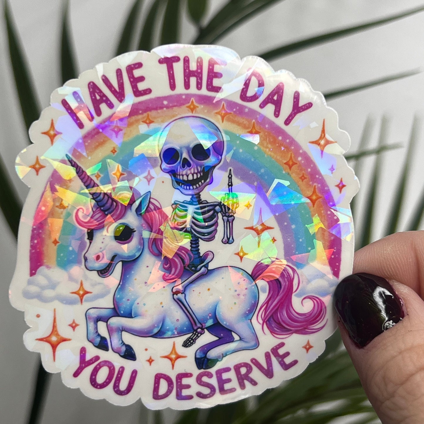 Holographic "Have the Day You Deserve" Skeleton Riding Unicorn Decal Middle Finger Rainbow Sticker | Sassy Funny Holographic Sticker