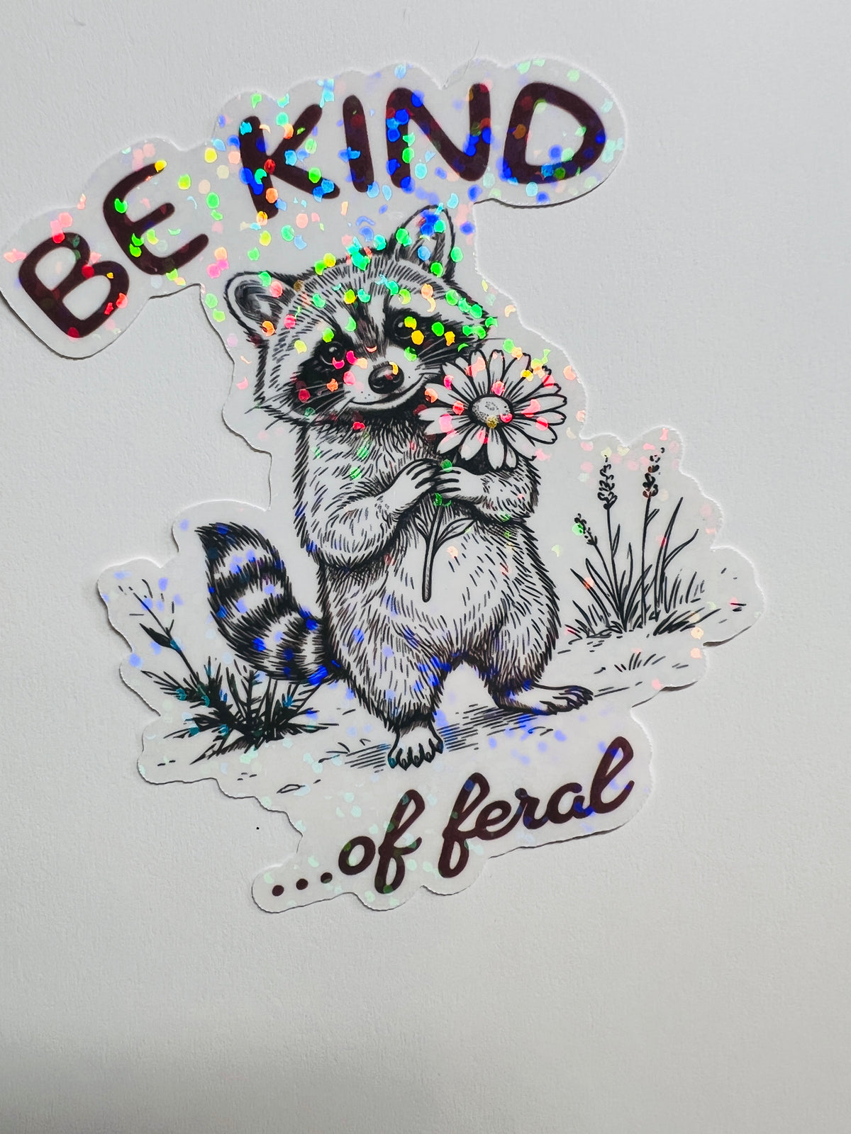 Be Kind… of Feral Raccoon Holographic Sticker