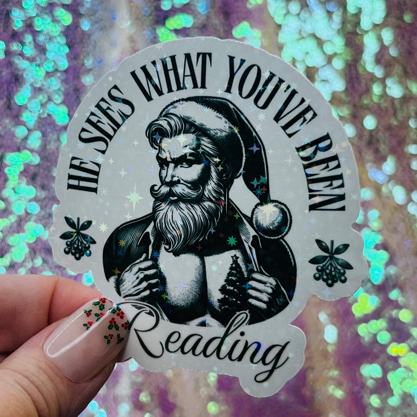 He Sees What You’ve Been Reading Holographic Santa Sticker – Book Lover Holiday Sticker