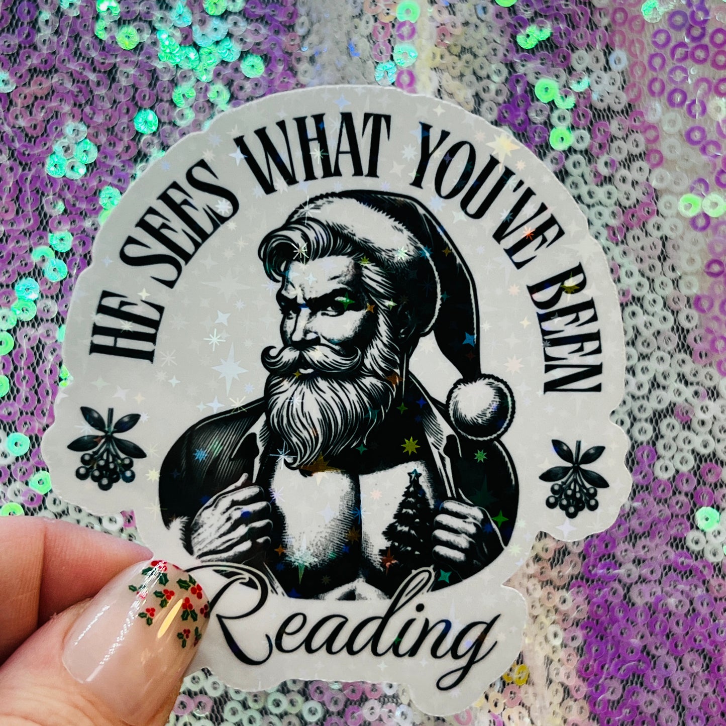 He Sees What You’ve Been Reading Holographic Santa Sticker – Book Lover Holiday Sticker