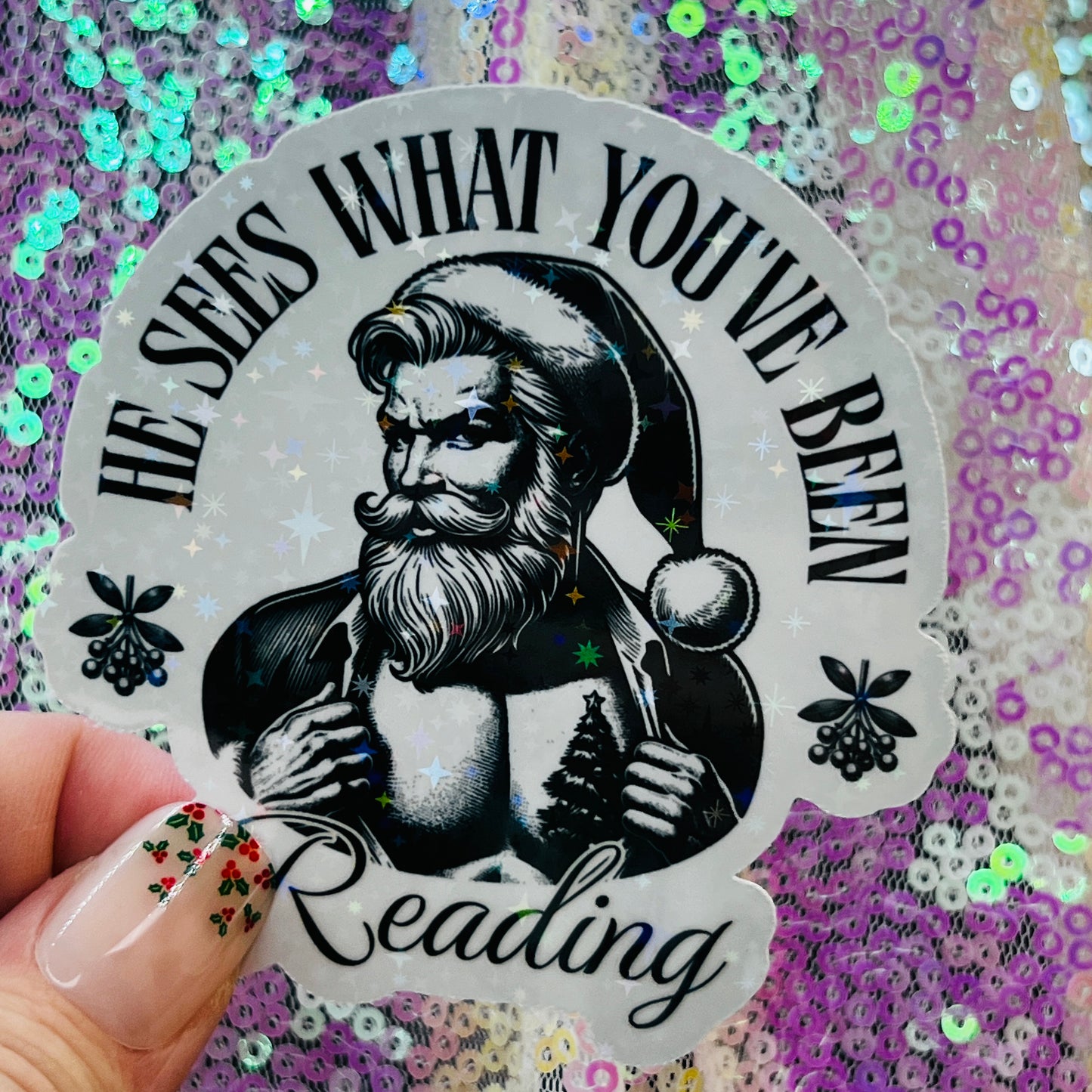 He Sees What You’ve Been Reading Holographic Santa Sticker – Book Lover Holiday Sticker