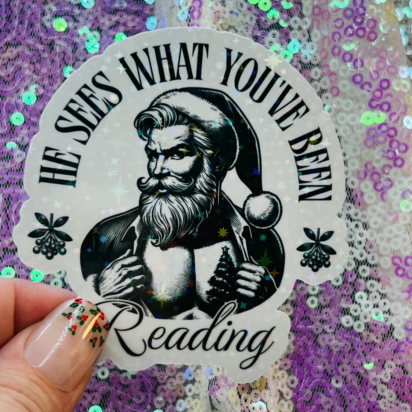 He Sees What You’ve Been Reading Holographic Santa Sticker – Book Lover Holiday Sticker