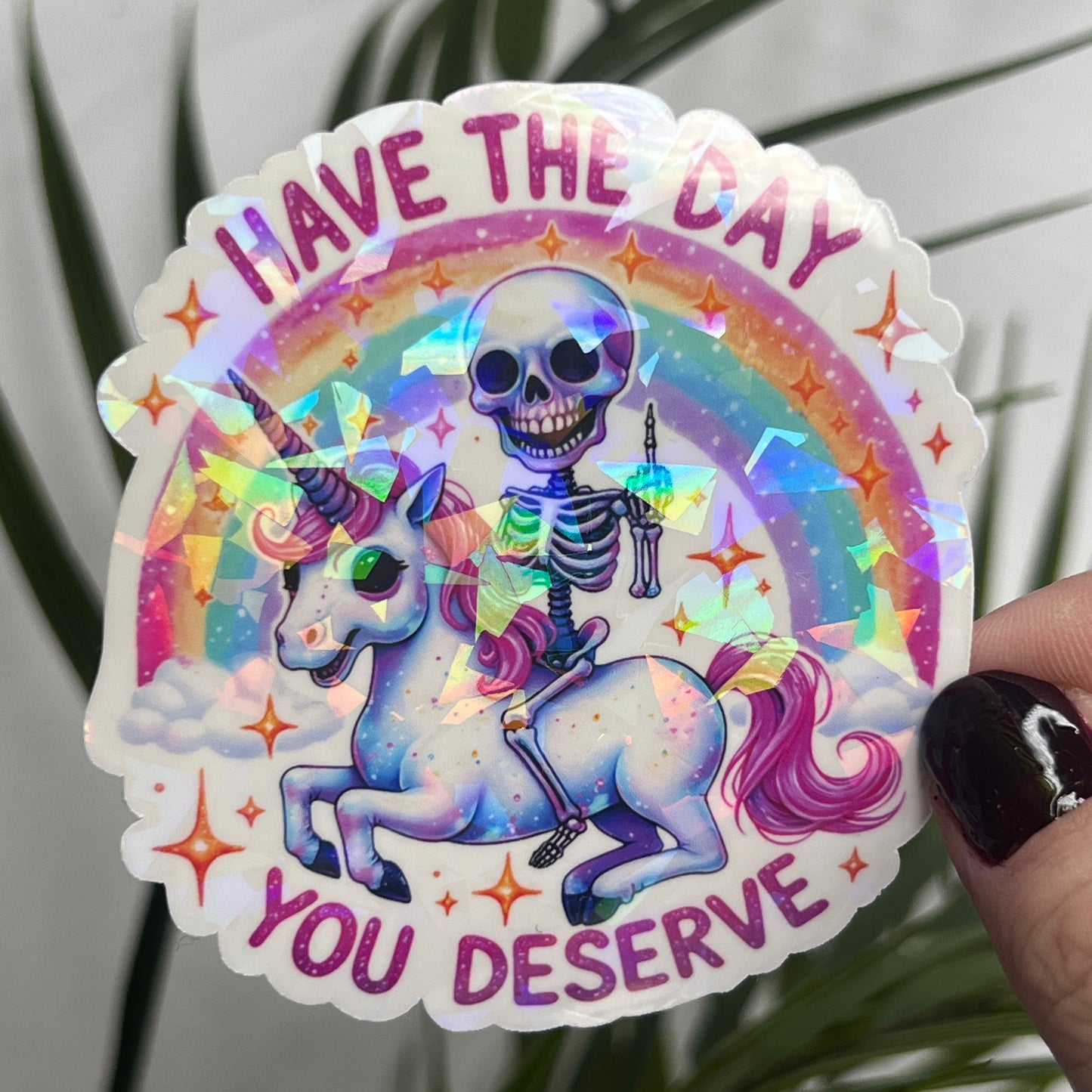 Holographic "Have the Day You Deserve" Skeleton Riding Unicorn Decal Middle Finger Rainbow Sticker | Sassy Funny Holographic Sticker