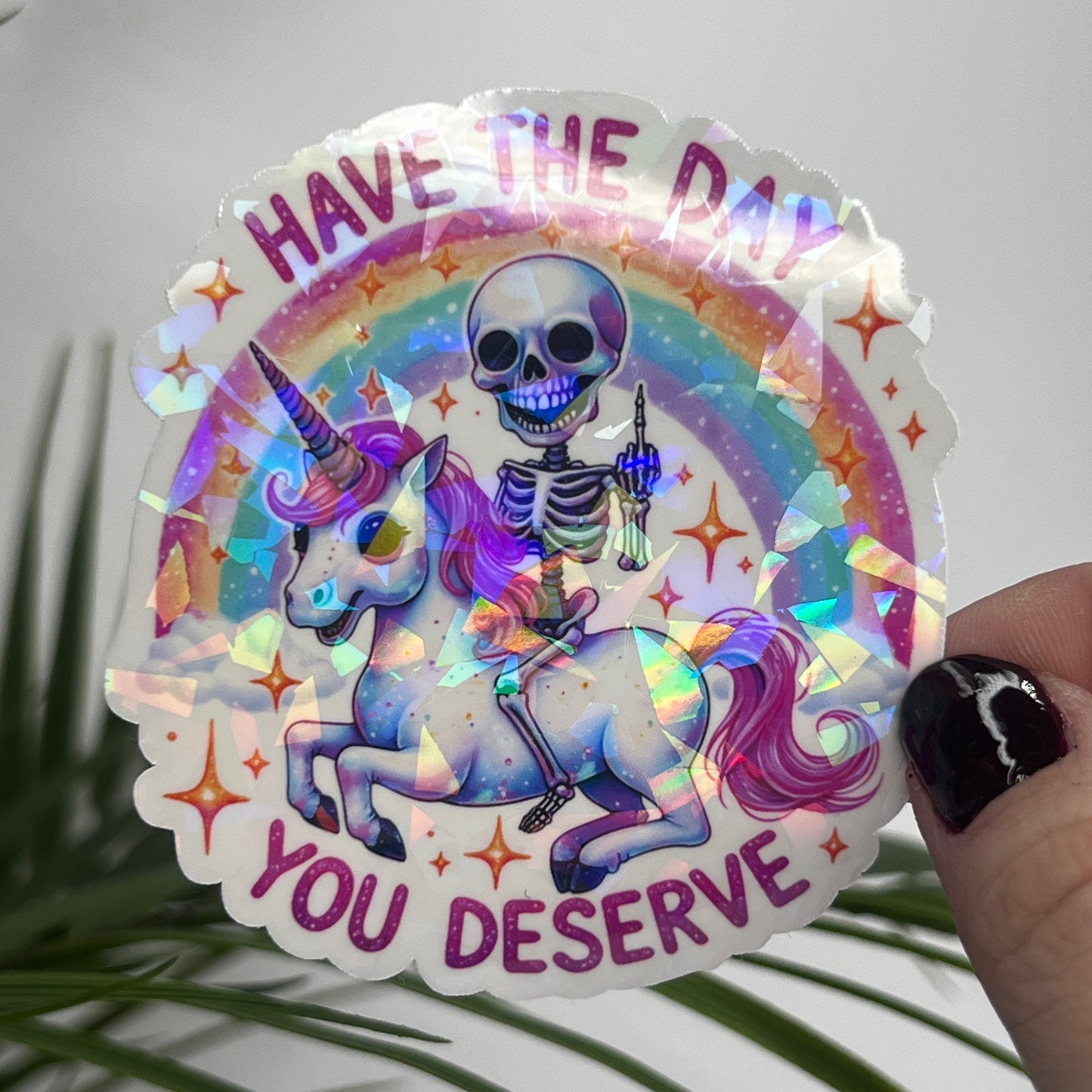 Holographic "Have the Day You Deserve" Skeleton Riding Unicorn Decal Middle Finger Rainbow Sticker | Sassy Funny Holographic Sticker