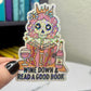 Wine Down With a Good Book Sticker - Female Skeleton Reading & Drinking Wine, Holographic Decal for Book and Wine Lovers Kindle Waterbottle
